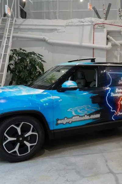 A Rivian car wrapped in Route 66 Centennial branding