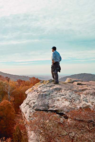 Man standing on top of a rock at Garden of the Gods