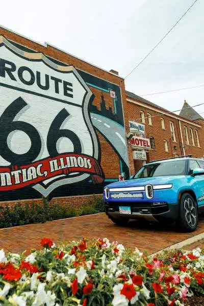 Rivian EV in front of the Route 66 Mural in Pontiac