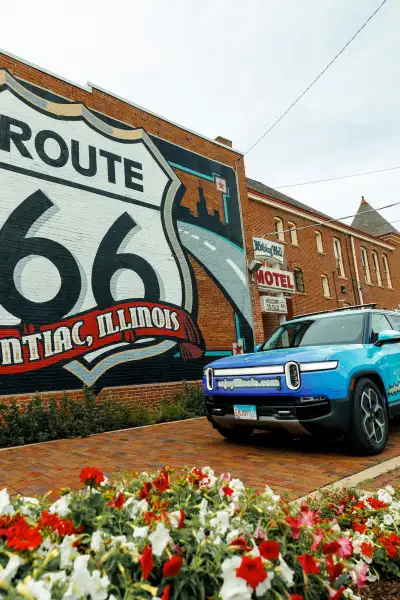 Rivian EV in front of the Route 66 Mural in Pontiac